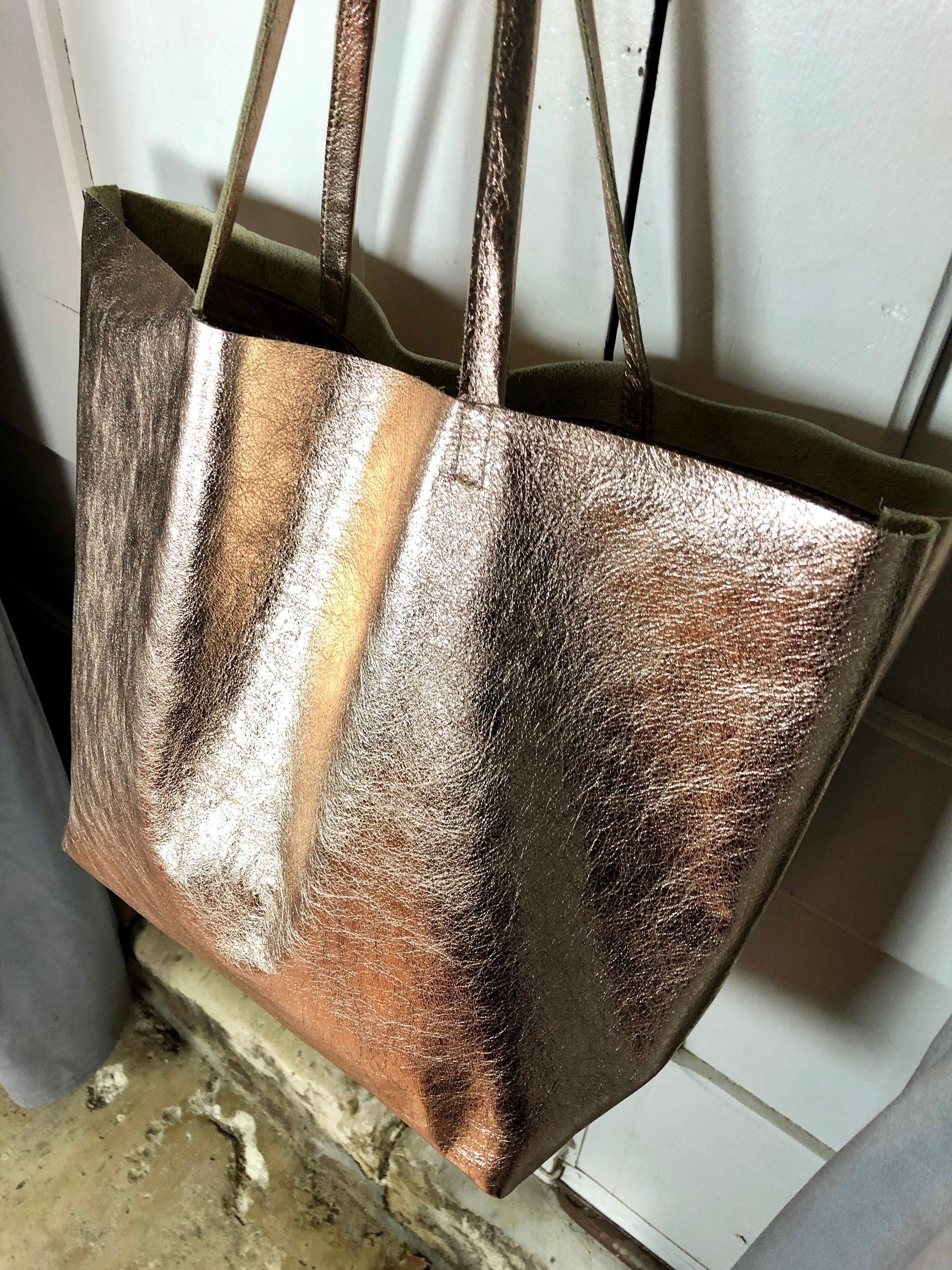 Metallic rose gold store handbag