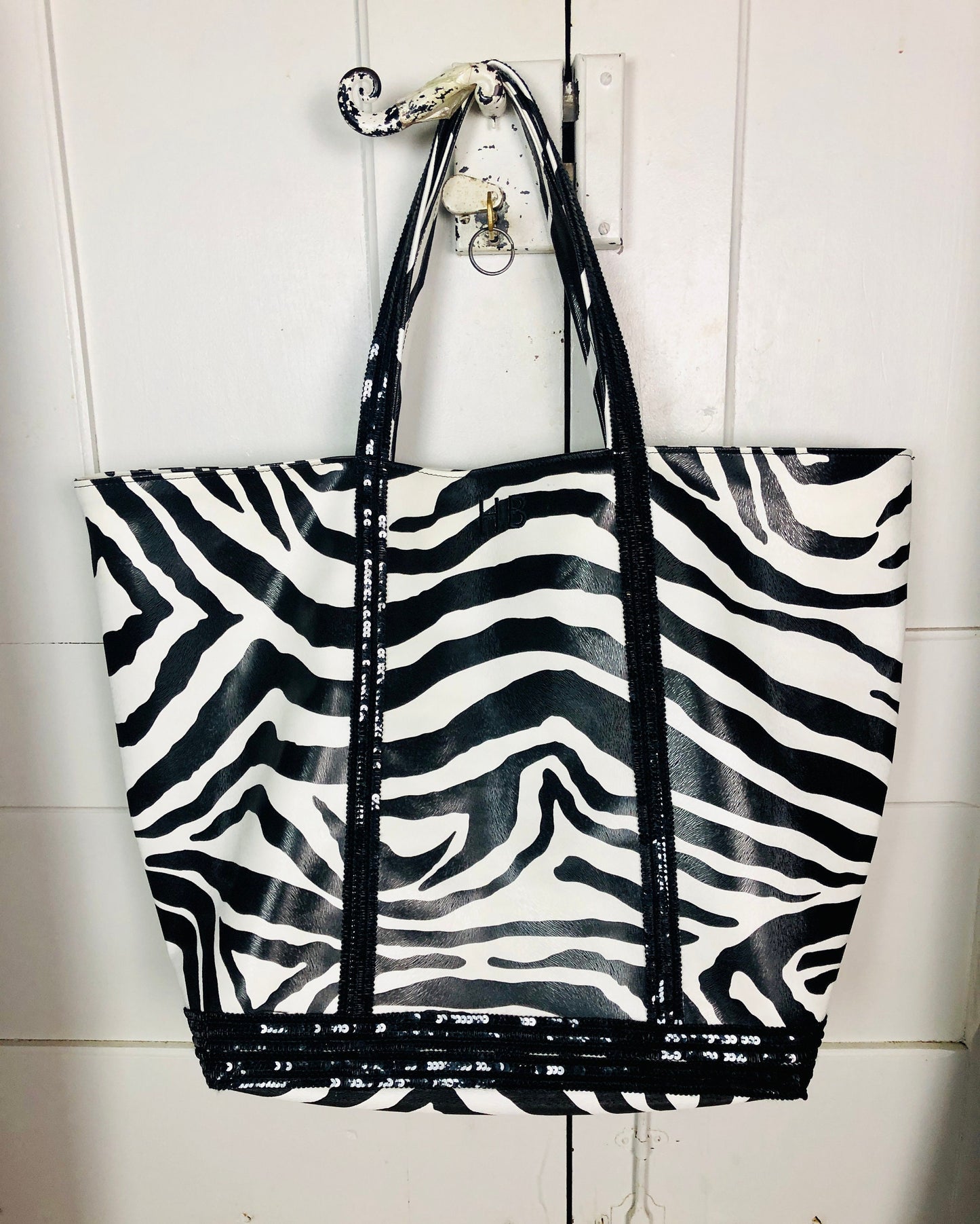 Faux leather zebra tote bag with black sequins